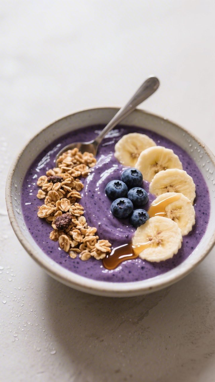 Final dish presentation: Beautifully plated smoothie bowl variation using the same blueberry smoothi